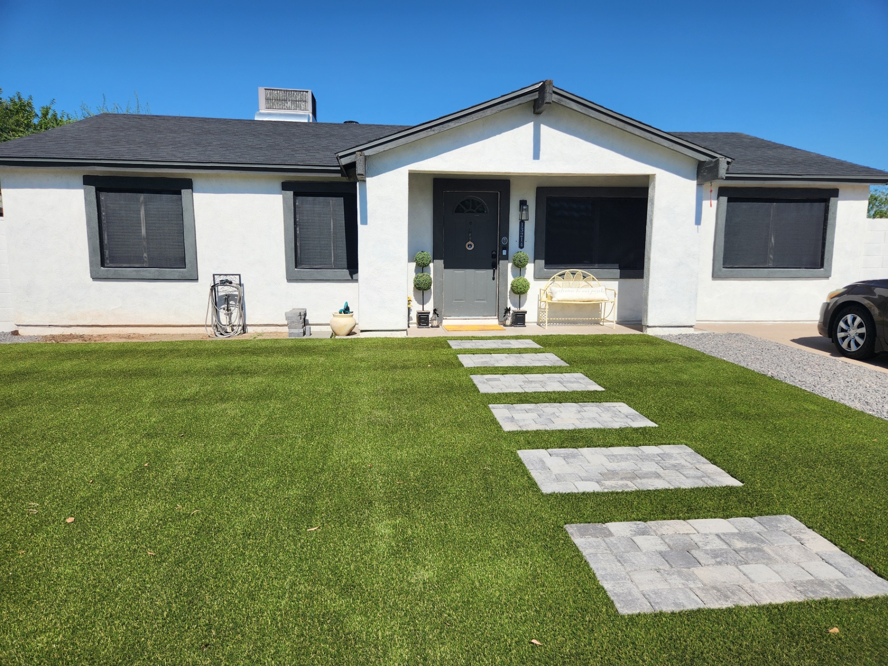 Home with sun screens and fresh turf install